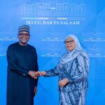 Tanzanian President Samia Suluhu Hassan and Dangote Industries Limited President and CEO Aliko Dangote shake hands during high-level discussions on industrialisation, regional energy infrastructure, and long-term economic development across Africa.