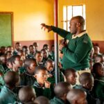 One of the HMCS officers engages pupils at Hhohho AME Primary School during a recent outreach programme on the dangers of gangsterism and substance abuse. Photo by HMCS
