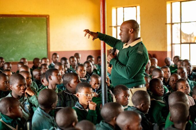 One of the HMCS officers engages pupils at Hhohho AME Primary School during a recent outreach programme on the dangers of gangsterism and substance abuse. Photo by HMCS