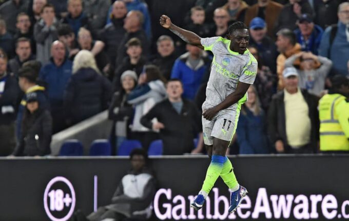 Manchester City winger Jeremy Doku celebrates after scoring his second goal of the night to earn City a 3-3 draw against Everton at Hill Dickinson Stadium in Liverpool. Photo by Getty Images