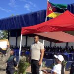 Royal Eswatini Police Service National Commissioner Manoma Vusie Masango presents appreciation certificates to Mozambican police officers for excellence across various fields during Mozambique's National Police Day celebrations at the Police Recruit Training School in Matalana.