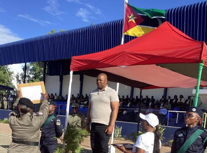 Royal Eswatini Police Service National Commissioner Manoma Vusie Masango presents appreciation certificates to Mozambican police officers for excellence across various fields during Mozambique's National Police Day celebrations at the Police Recruit Training School in Matalana.