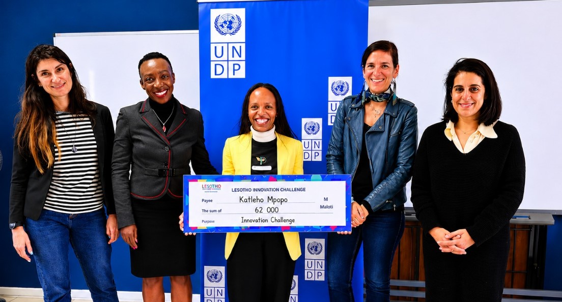 Peace Farm founder Katleho Mpopo displays her M62,000 Lesotho Innovation Challenge cheque alongside stakeholders. | Photo: NUL Research and Innovations