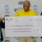 Officials from the Eswatini Olympic and Commonwealth Games Association (EOCGA) and Basketball Eswatini pose with the E490,000 cheque during the official launch of the Development of National Sports System (DNSS) Programme, funded through Olympic Solidarity.
