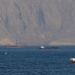US military vessels escort commercial ships through the Strait of Hormuz on Monday