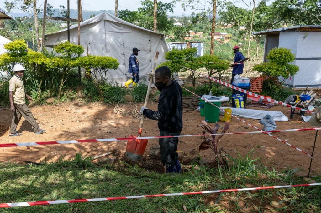 Workers setting up a treatment center run by Doctors Without Borders at Mongbwalu General Hospital on Tuesday. Photo by The New York Times