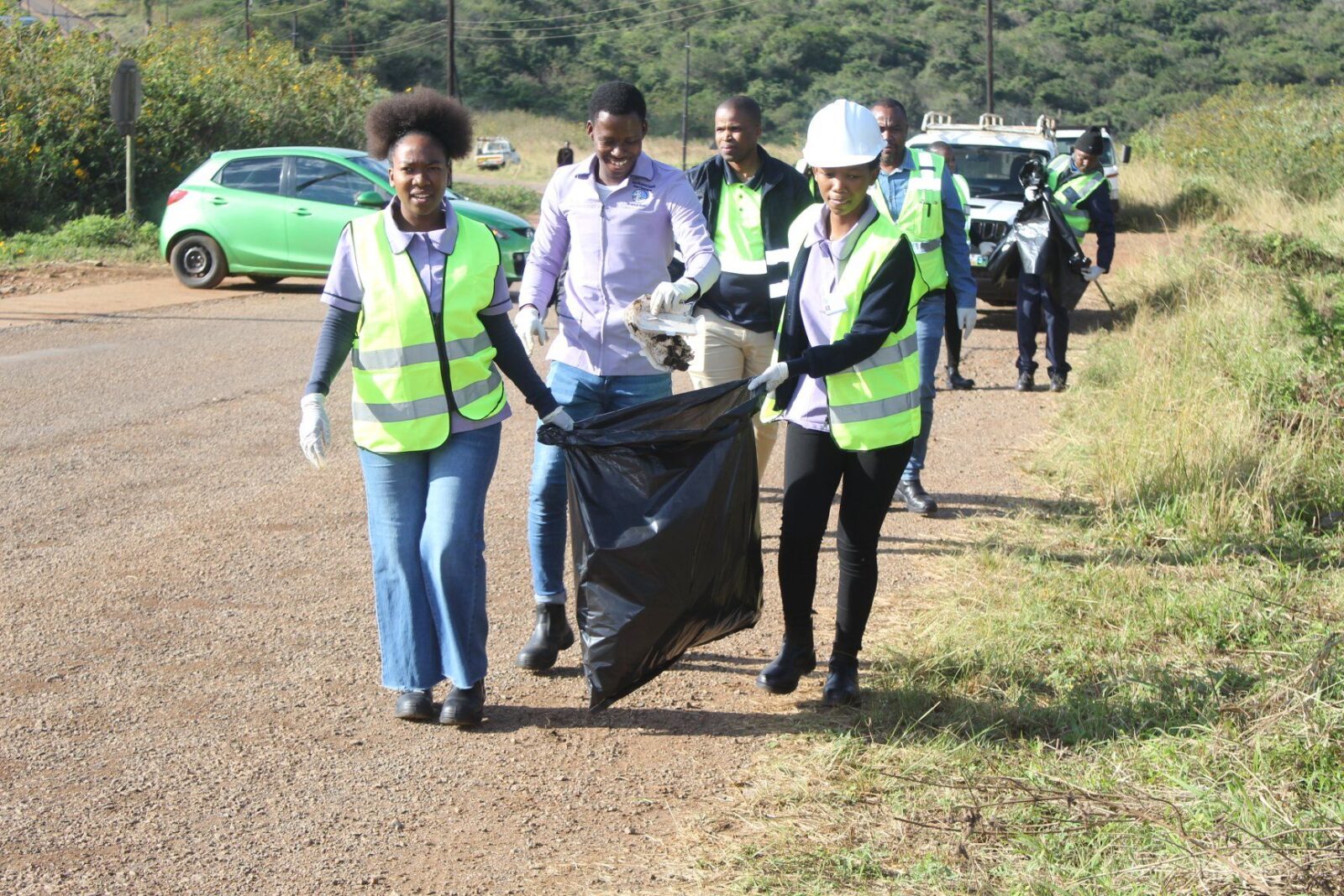 Community members, Siteki Town Council officials and representatives from participating organisations collect litter along the entrance points of Siteki Town during a World Environment Day clean-up campaign. (Photo: Siteki Town Council)
