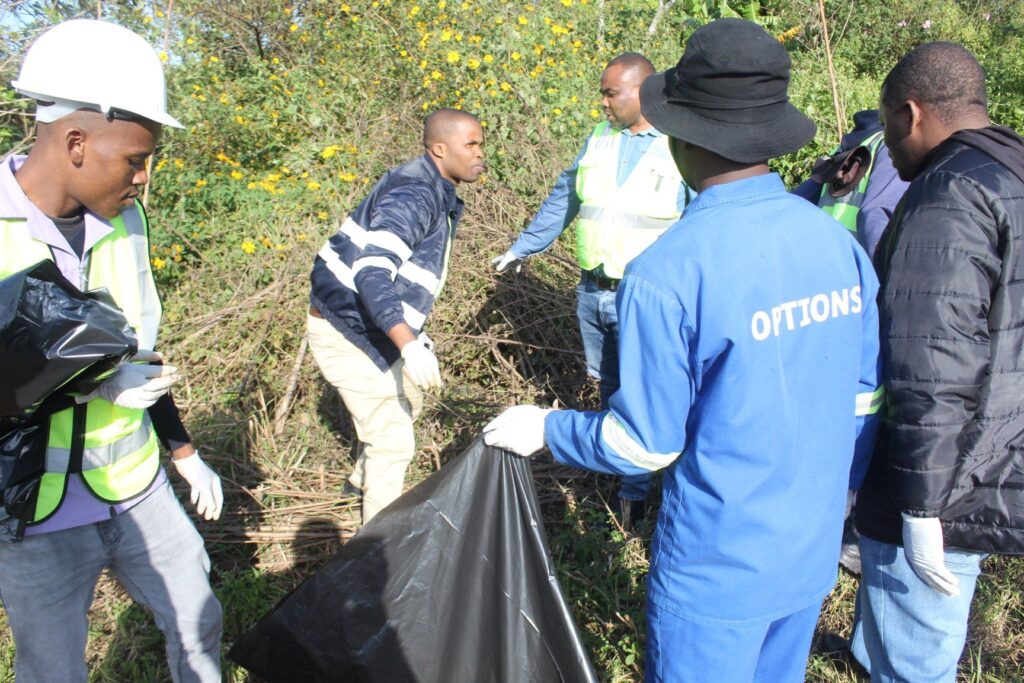 Community members, Siteki Town Council officials and representatives from participating organisations collect litter along the entrance points of Siteki Town during a World Environment Day clean-up campaign. (Photo: Siteki Town Council)