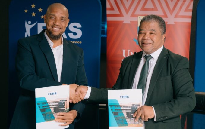 ERS Commissioner General and UNESWA Vice Chancellor Professor Justice M. Thwala exchange signed copies of the Memorandum of Understanding formalising a partnership to deliver specialised AI training for ERS employees through the UNESWA AI Academy. | Photo: ERS