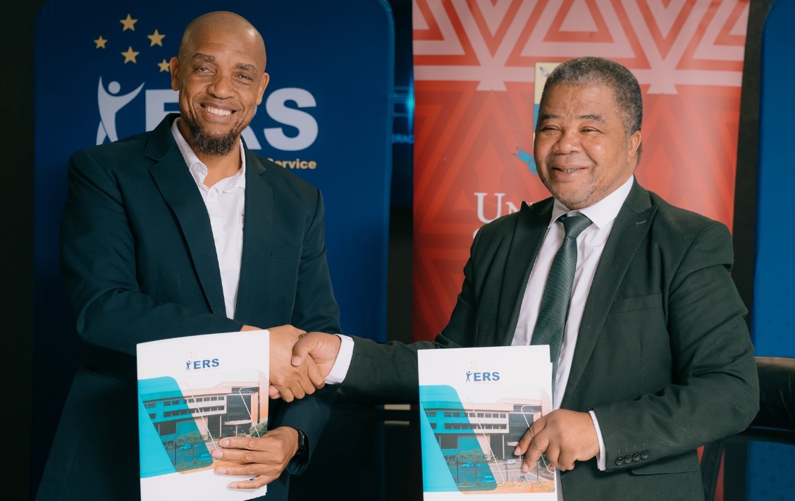ERS Commissioner General and UNESWA Vice Chancellor Professor Justice M. Thwala exchange signed copies of the Memorandum of Understanding formalising a partnership to deliver specialised AI training for ERS employees through the UNESWA AI Academy. | Photo: ERS