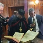 Ethiopian Heritage Authority officials examine the 17 ancient books returned to Ethiopia from the United States before their handover to seven institutions for professional assessment, preservation and research. Photo credit: Ethiopian Broadcasting Corporation
