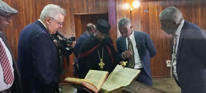 Ethiopian Heritage Authority officials examine the 17 ancient books returned to Ethiopia from the United States before their handover to seven institutions for professional assessment, preservation and research. Photo credit: Ethiopian Broadcasting Corporation