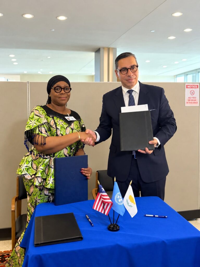 Liberian Foreign Minister Sara Beysolow Nyanti and Cyprus Foreign Minister Constantinos Kombos display the signed Memorandum of Understanding on Political Consultations following their meeting in New York. Photo: Liberia Ministry of Foreign Affairs