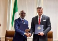 Nigeria’s Minister of Solid Minerals Development Dele Alake and US Deputy Secretary of State Christopher Landau shake hands after signing the mining cooperation agreement in New York, with copies of the MoU in hand. Photo: X/@AlakeDele