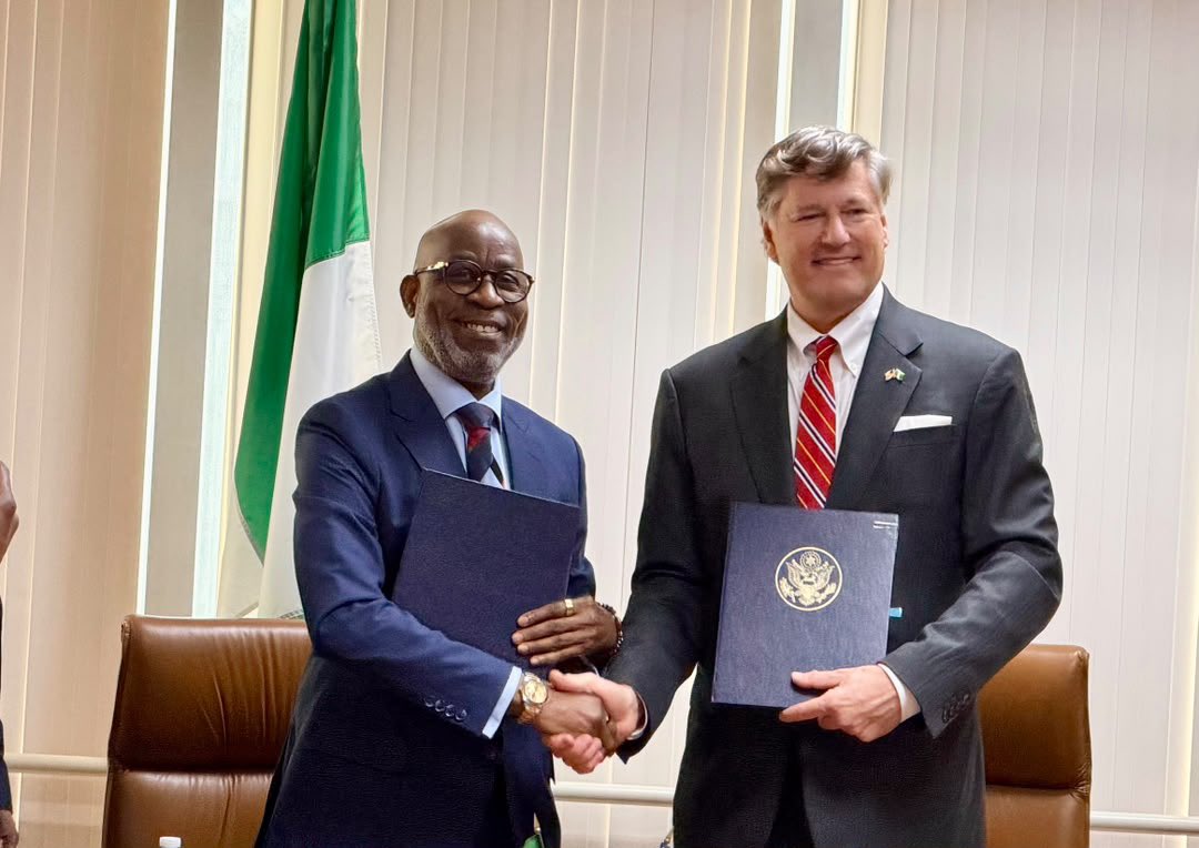 Nigeria’s Minister of Solid Minerals Development Dele Alake and US Deputy Secretary of State Christopher Landau shake hands after signing the mining cooperation agreement in New York, with copies of the MoU in hand. Photo: X/@AlakeDele