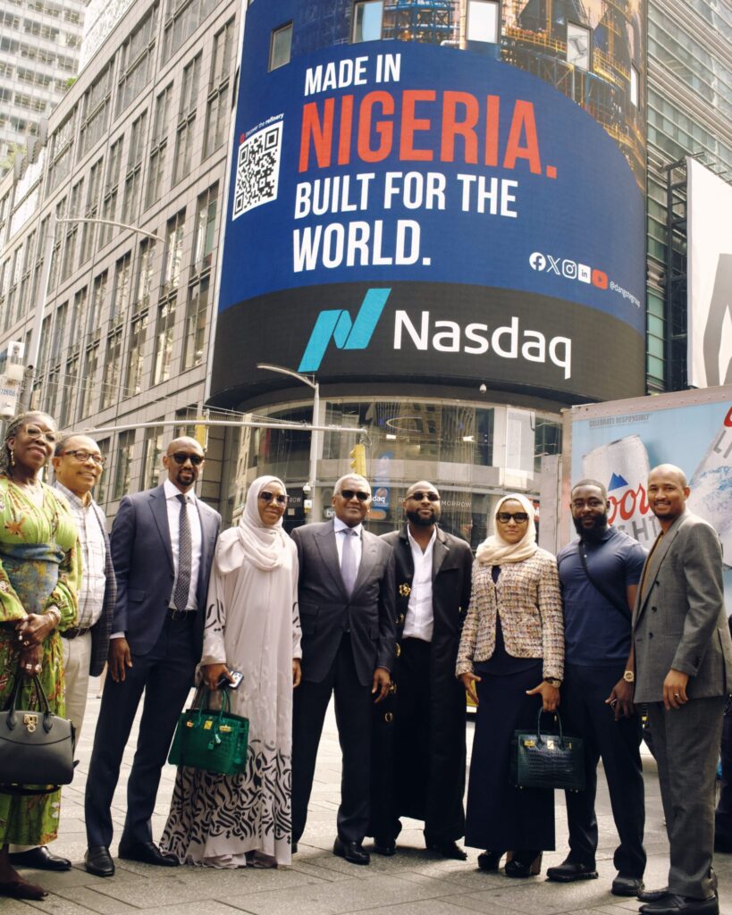 Davido and Aliko Dangote pose with other stakeholders at Times Square in New York during the promotion of the Dangote Petroleum Refinery IPO. Photo: X/@davido