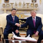 US President Donald Trump and Chinese President Xi Jinping shake hands during their meeting at the White House in Washington, DC.