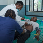 A doctor attends to one of the victims receiving treatment in hospital following the suspected alcohol poisoning outbreak in Ondo State, Nigeria. Photo: France 24