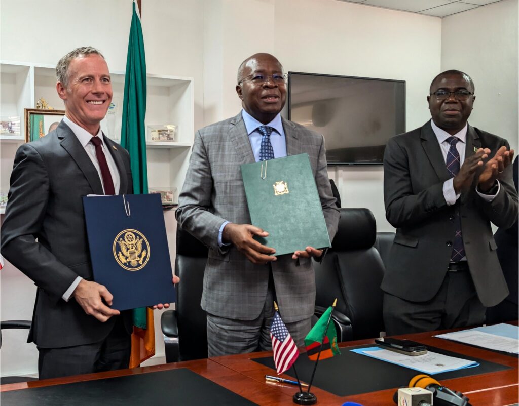 Zambian and US officials pose with the signed MoU to strengthen healthcare and combat infectious diseases. Photo: X/@usembassyzambia