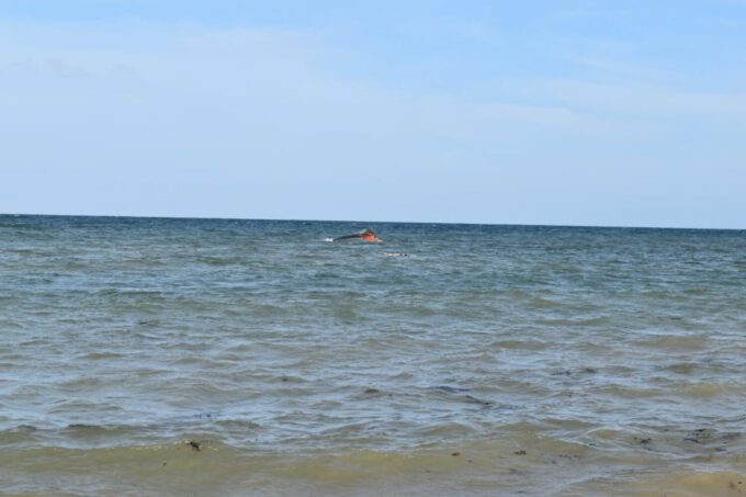 A portion of the vessel floats after it capsized while carrying about 305 people from Djibouti to Yemen, leaving at least 109 migrants, including 15 children, dead and more than 116 missing, according to the United Nations' International Organization for Migration (IOM) on October 10, near Guhere, north of the port town of Obock, Djibouti, in this photograph released on October 10, 2026.